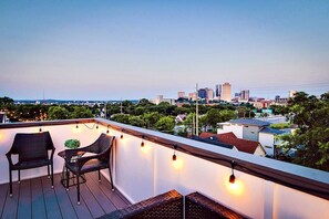 Enjoy evening sunsets on the rooftop deck boasting one of the highest points in the neighborhood!