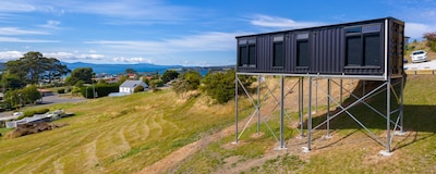 New elevated container house with stunning rural and ocean views