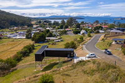 New elevated container house with stunning rural and ocean views