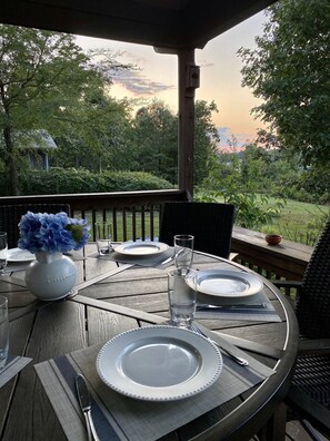 Dining table w/swivel rocking chairs on the deck