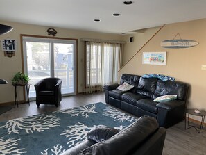 Family room with view of 2nd floor deck