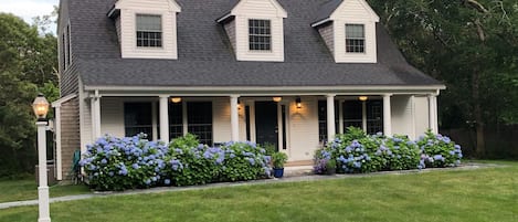 Front yard and porch of Katama Winds.  Enjoy our Adirondack seating.