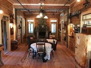 Cabin interior. Antique reclaimed pine. Dining table seats 4. 