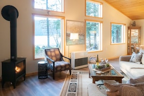 The living/dining room looks out on Kenai Lake.