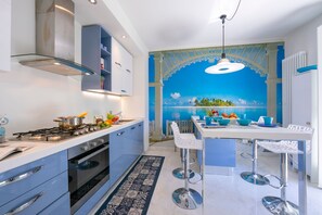The kitchen is modern and has all equipment