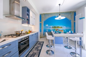 The kitchen is modern and has all equipment