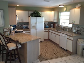 Spacious kitchen with all appliances. New dishwasher and microwave.