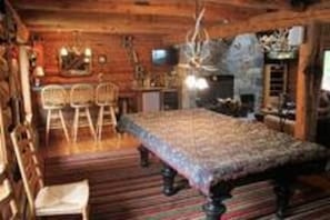 Part of Great Room with 2 large TVs, pool table, shuffle board, wet bar, arcades