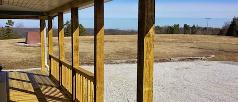 View from deck of cabin to  pasture rolling into the Ozark National Forest