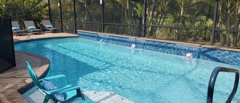 Custom built 32'x17' saltwater electric heated pool with sun shelf and bubbler.