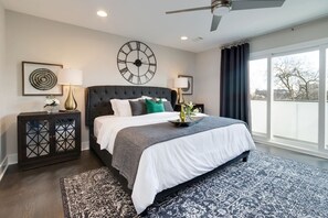 Master bedroom with a private, walk out balcony with downtown views