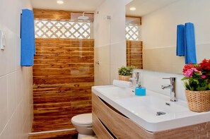 full Bathroom #2 with wood finishes