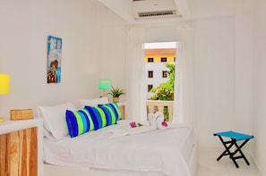 Bedroom # 1 with a balcony to the park inside the condominium
