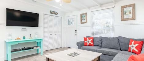 Living Room with large sectional seating and large flat screen TV