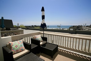 two lounge chairs on deck off master bedroom