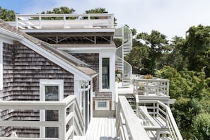 Sliders from many rooms lead to multiple levels of decking.  