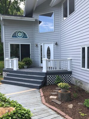 Entry way and front deck for grilling.