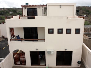 Side view showing 2nd story master bedroom balcony and upper deck and bedroom