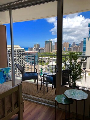 Lanai with comfortable seating and great ocean, city and mountain views