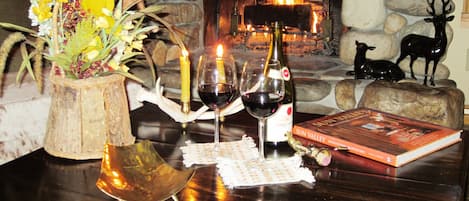 Enjoy your welcome bottle of wine by the fireplace with views of Baldy Mountain