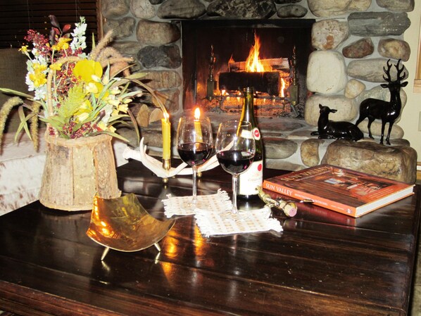 Enjoy your welcome bottle of wine by the fireplace with views of Baldy Mountain