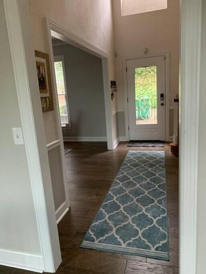 Newly painted and floored entry way.
