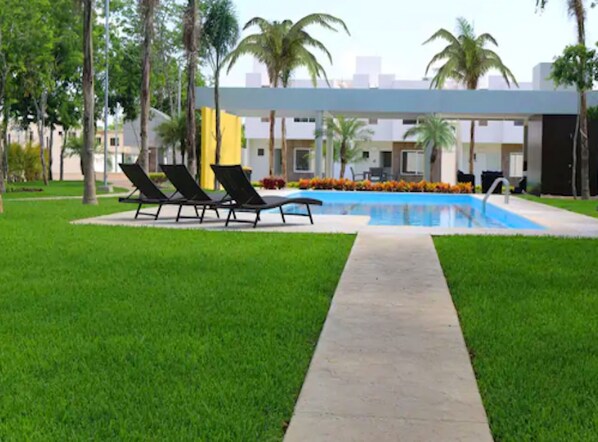 Beautiful swimming pool next to the house