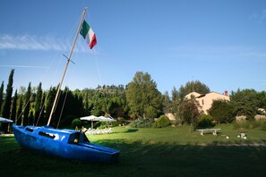 Sky, Boat, Flag, Water Transportation, Vehicle, Tree, Watercraft, River, Landscape, Lake