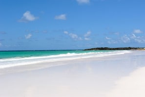 Windermere Beach, a miles-long, world-class pink sand beach, 100 yards from Utopia.