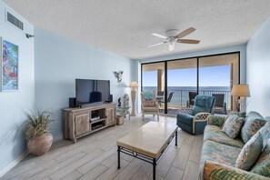 Spacious Living Area with a Sleeper Sofa and Access to the Private Balcony