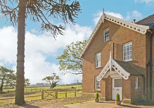 Old Hall Farmhouse external view and fields
