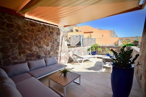 Terrace with sun loungers