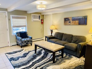 Spacious living room area with coastal decor