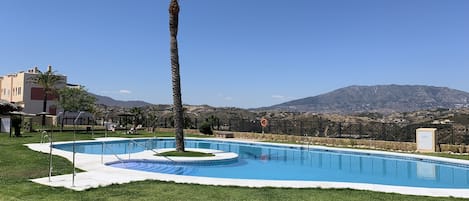 Pool with views to the mountains and sea.