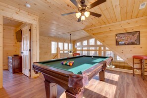 Loft with a game room, including a full-size pool table.