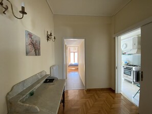 Hallway to the main bedroom, bathroom and kitchen