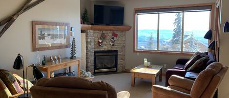 Living room with great view and plush, comfy furniture for relaxing.