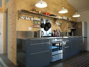 An open galley Kitchen has everything you need to cook your own meals. 