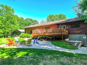 The back deck looks over the fire pit and hot tub