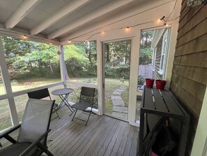 Private screened-in porch.  Walkway to outdoor shower.