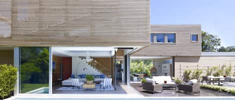 Glass walls disappear to allow the ultimate in indoor/outdoor living!