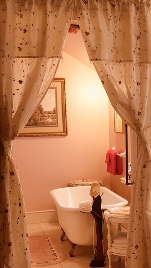 Clawfoot bathtub & separate shower ensuite in this beautiful bedroom.  