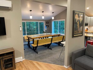 upper floor open concept living room with kitchen and dining area