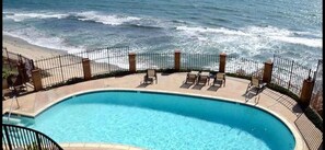 pool in complex overlooking ocean. 