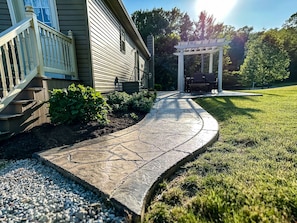 Sidewalk to the back patio.
Make tea with the mint growing on the left.