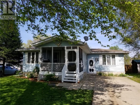 Welcome to a charming spot!  Parking available, sit on the screened porch!