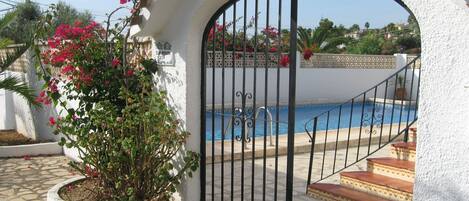 Gate, pool and stairs, main entrance