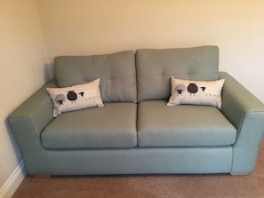 One of our sofas with sheep cushions. Northumberland has more sheep than people!