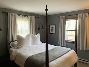 First floor primary bedroom with queen bed