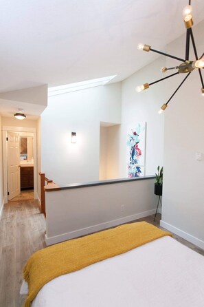 The bedroom (w/ premium queen bed) feels as open as bright as the picture shows.